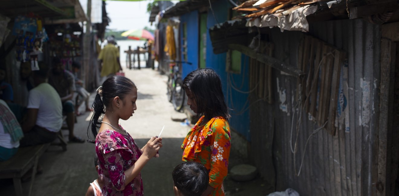 Bangladeshi children stand outside in Barisal.