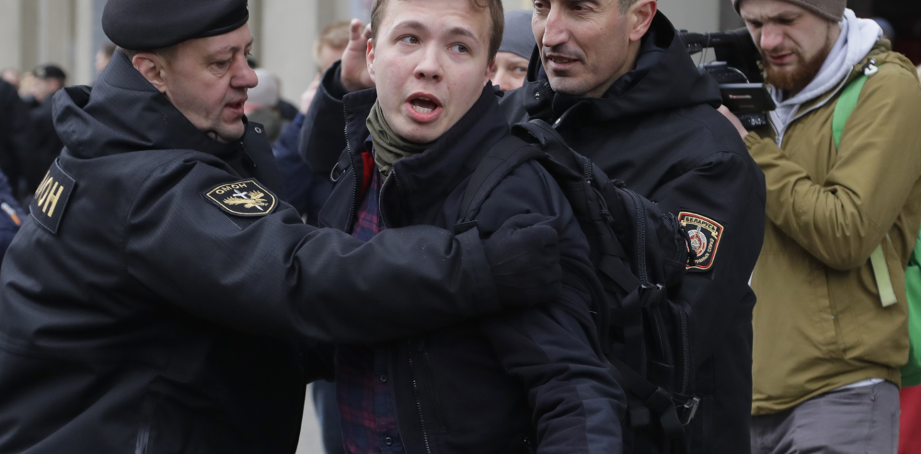 Belarus police detain journalist Roman Protasevich in Minsk, Belarus, Sunday, March 26, 2017. Dozens protestors were detained during attempt to rally in downtown Minsk. ﻿﻿(AP Photo/Sergei Grits)