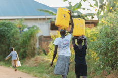 women carrying water in Uganda