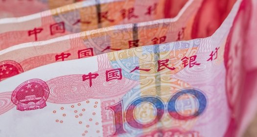 A closeup of a stack of Renminbi banknotes