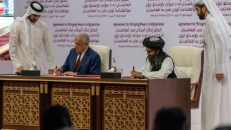 U.S. Special Representative for Afghanistan Reconciliation Ambassador Zalmay Khalilzad participates in a signing ceremony in Doha, Qatar. (DoS photo)