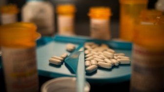 Opioid pills on a prescription tray