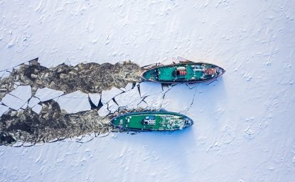 Two icebreakers breaking ice on Vistula river, Poland, 2020-02-18, aerial view