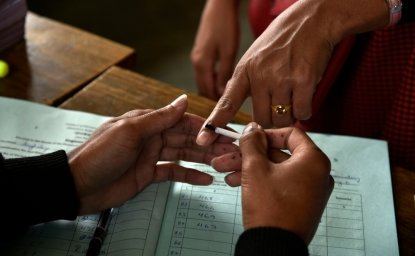 Finger being inked before voting in Indian elections