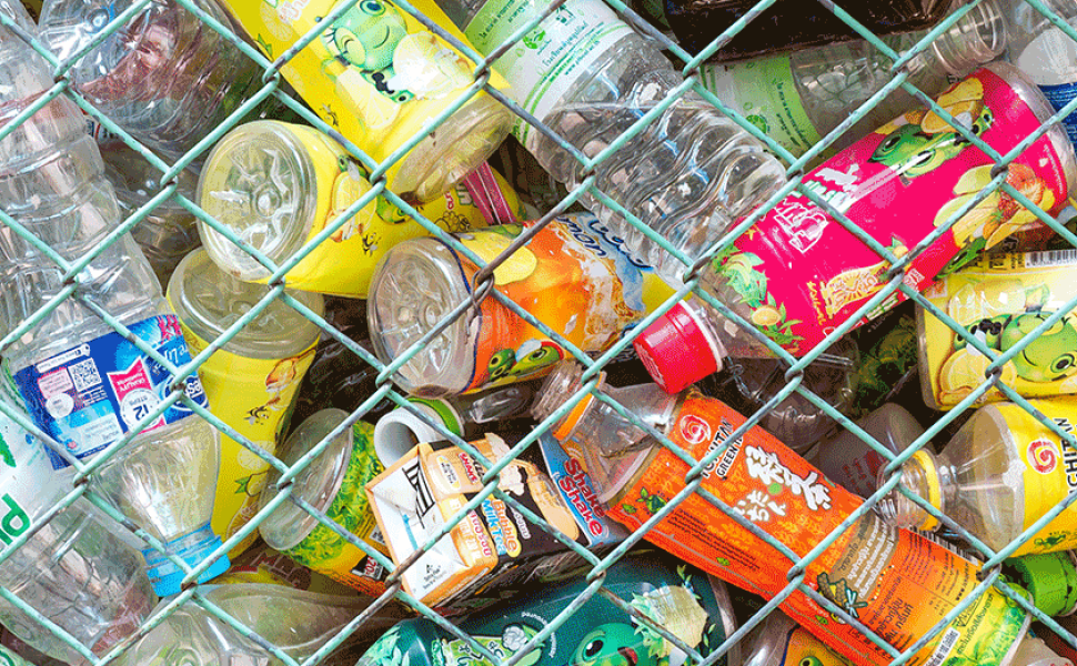 Plastic bottles behind a fence