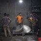 Young men in Dhaka's Buriganga river shipyards