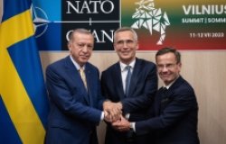 President Recep Tayyip Erdoǧan of Türkiye, Prime Minister Ulf Kristersson of Sweden, and NATO Secretary General Jens Stoltenberg after reaching an agreement ahead of NATO Summit in Vilnius, July 2023