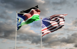 National flags of South Sudan and USA together at the sky background