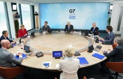 The leaders of the G7 countries sit around a round table.