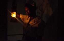 Women lighting a lantern.