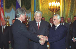 image of three men shaking hands at the same time