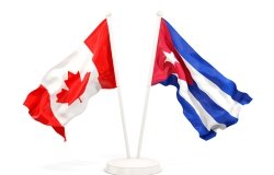 Two waving flags of Canada and cuba isolated on white