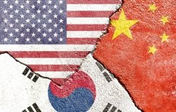 China, Korea, and US flags on concrete